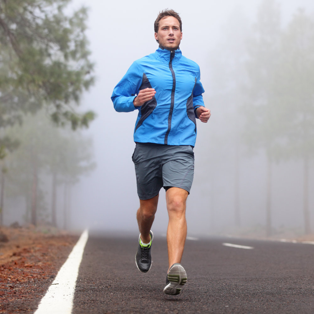 Man running in fog